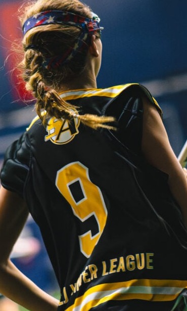 Lacrosse athlete seen from behind